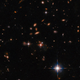 A Hubble Wide Field image of distant galaxies, one of which is the relevant quasar.
